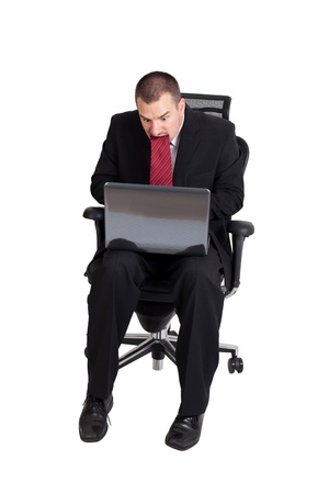 Young business man stressing and chewing tie  Isolated on white backgroundの写真素材
