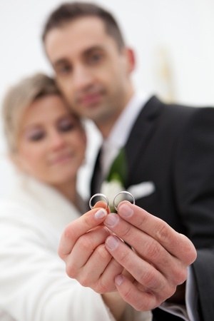 Wedding detail of the rings and hands holdingの写真素材