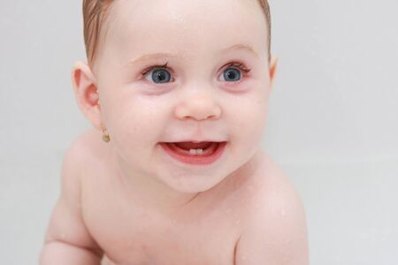 Baby smile with two teethsの写真素材