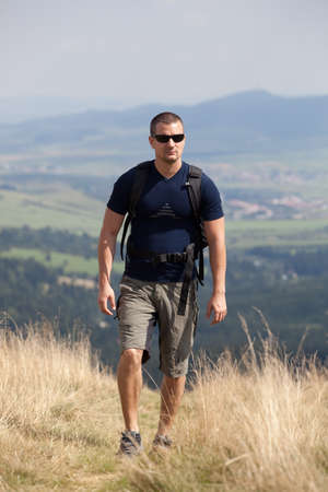 sportive man on the mountain trekの写真素材
