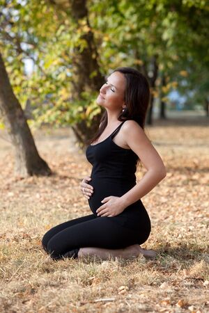 Pregnant woman in the parkの写真素材
