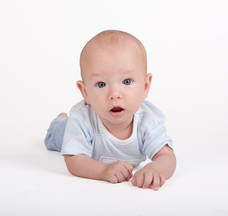 Portrait of sweet little baby boy on a white backgroundの写真素材