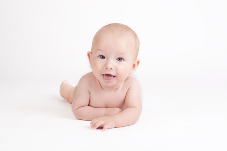 Portrait of sweet little baby boy on a white backgroundの写真素材