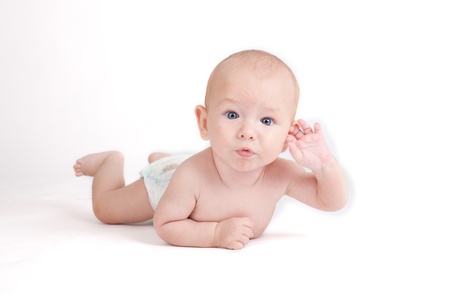 Portrait of sweet little baby boy on a white backgroundの写真素材