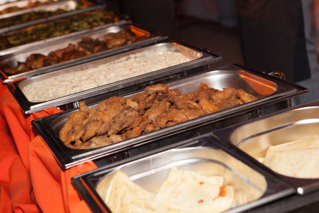 Banquet meal trays served on tablesの写真素材