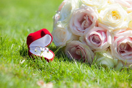 Betrothal detail of the rings and bouquet