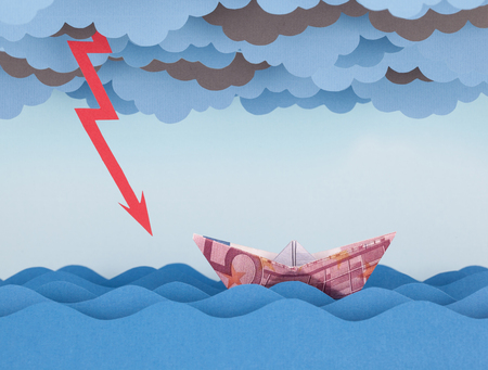 Euro boat in storm. Paper waves and cloudsの写真素材