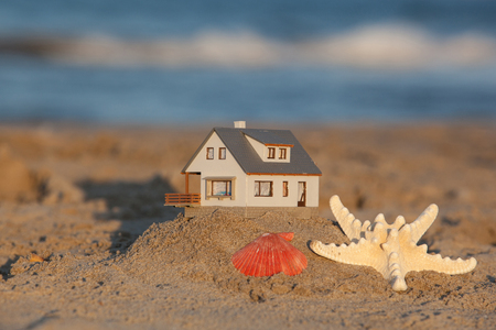 Close up of model house on the sandy beach. Blur Backgroundの写真素材