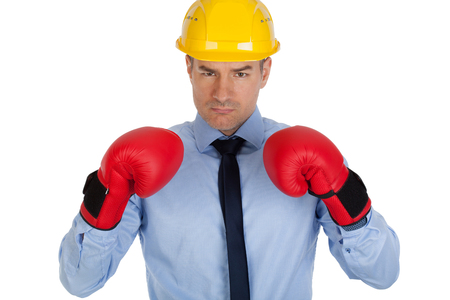 Angry architect with boxing gloves. Isolated on white background.の写真素材