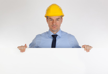 Architect with horizontal blank board. Isolated on white backgroundの写真素材