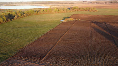 Aerial view with. spring agricultural countryside landscape with unplowed fieldsの写真素材
