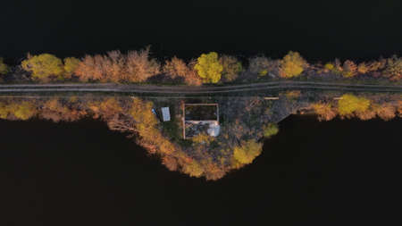 aerial view of an abandoned house on the lakeの写真素材