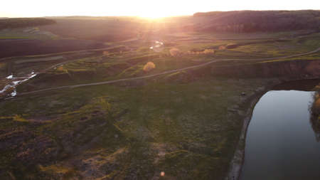 field sunset greenery river aerial view droneの写真素材