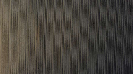 Background of brown earth at high altitude aerial view. Aerial drone view of freshly plowed field ready for seeding and planting in spring.の写真素材