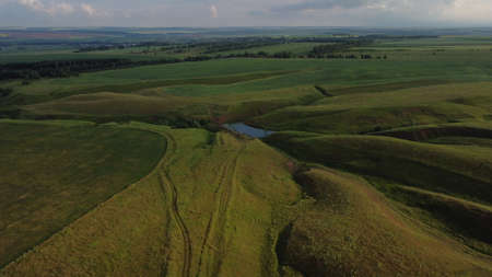 Aerial view of summer fields being, farmland and country landscapeの写真素材
