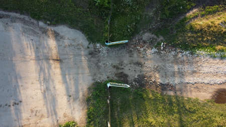 Rural landscape. Dirt road in the village. View from the heightの写真素材