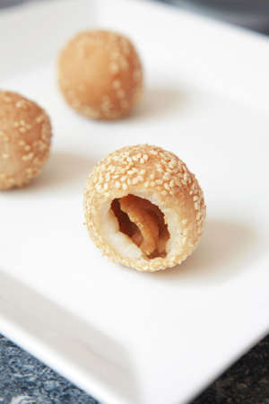 This is a traditional dimsum, fried glutinous ball with lotus filling inside.の写真素材