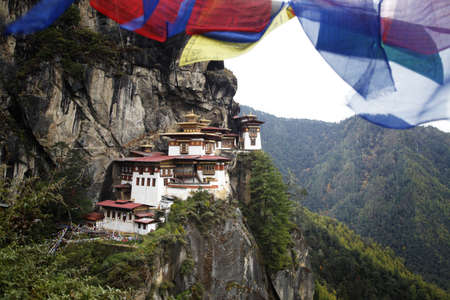 Prayer flags above the sacred Tatkshang Lhakang, Bhutan.の写真素材