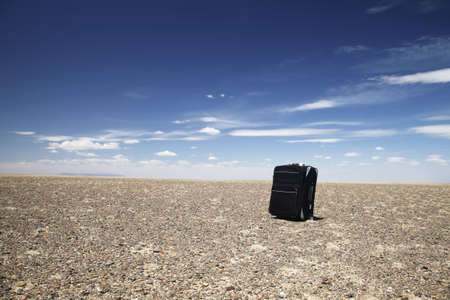 A black lone travelling baggage in Gobi desert, Mongolia.の写真素材