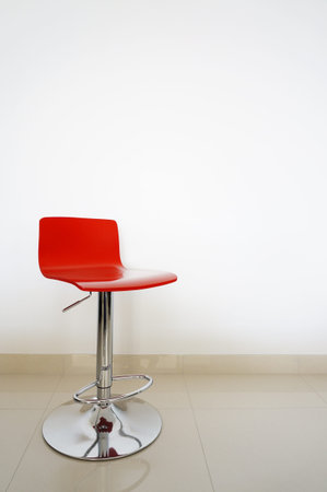 Red bar stool isolated onto white background. 