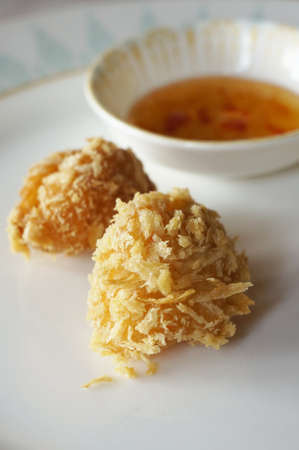 Deep fried prawn dumpling, served at Oriental Hotel, Bangkok with Chilli sauce.の写真素材