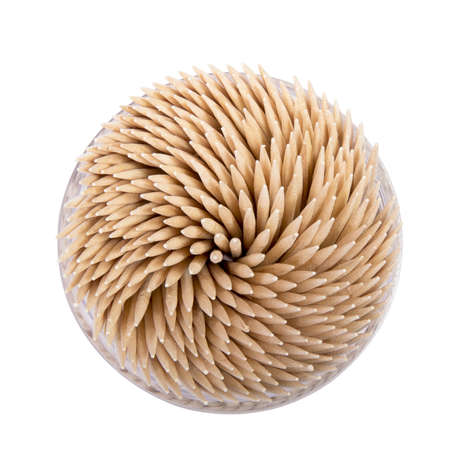 Toothpicks in a round box, top view, isolated on white background の写真素材