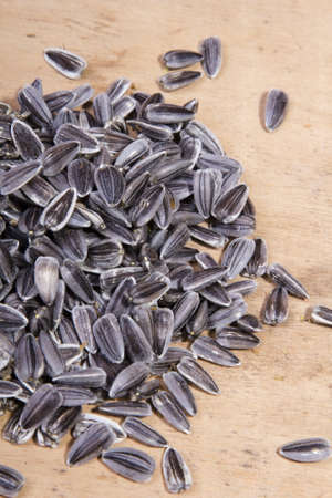 sunflower seeds on a wooden backgroundの写真素材