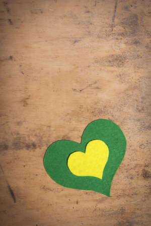 felt hearts on a wooden backgroundの写真素材