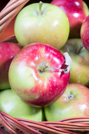 apples in a wicker basketの写真素材
