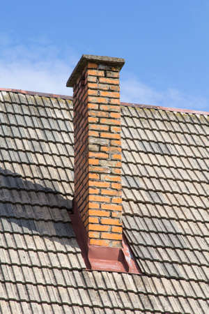 brick chimney on the roofの写真素材