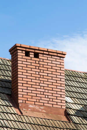 brick chimney on the roofの写真素材
