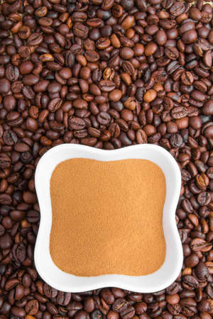 coffee powder on coffee beansの写真素材
