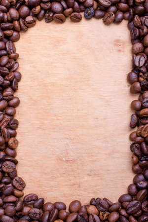 Coffee beans frame on a wooden の写真素材