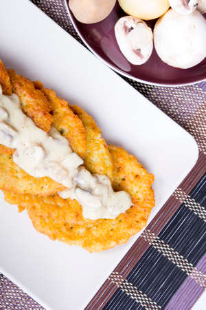 potato pancakes with mushroom sauceの写真素材