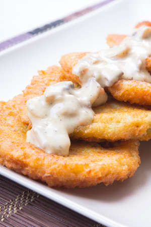 potato pancakes with mushroom sauceの写真素材