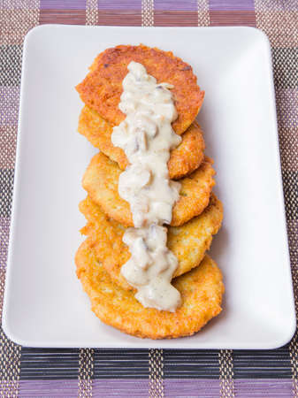 potato pancakes with mushroom sauceの写真素材