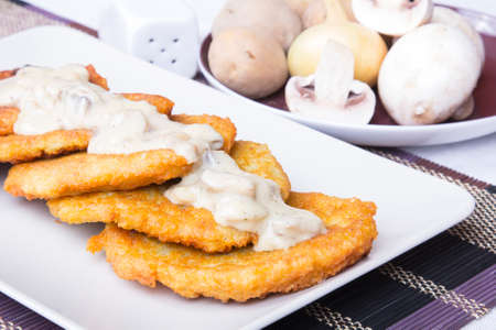 potato pancakes with mushroom sauceの写真素材
