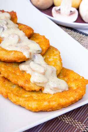 potato pancakes with mushroom sauceの写真素材