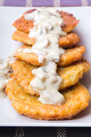 potato pancakes with mushroom sauceの写真素材