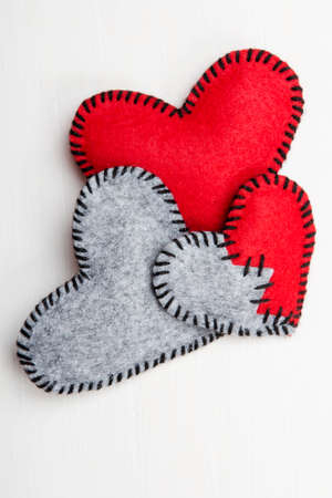 felt heart on a white wooden , valentines compositionの写真素材