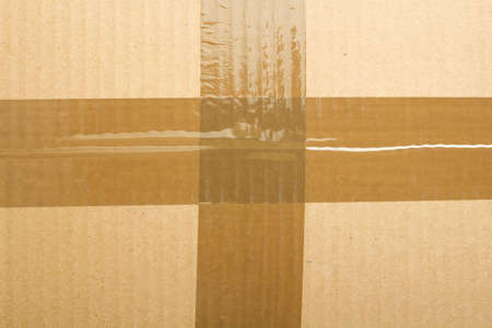 texture of cardboard and adhesive tape for backgroundの写真素材