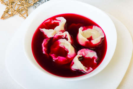 Red borsch with dumplings, traditional Polish Christmas Eve dishの写真素材