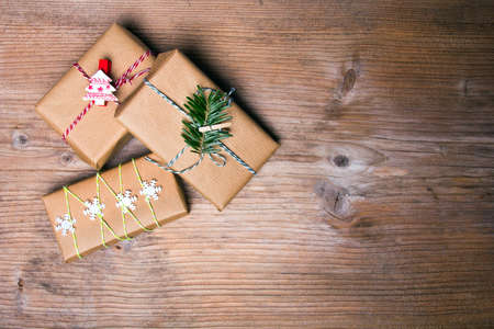 Christmas presents on wooden background, retro style with copy spaceの写真素材