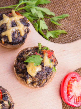 Stuffed champignons with eggs, cheese and paprika.の写真素材