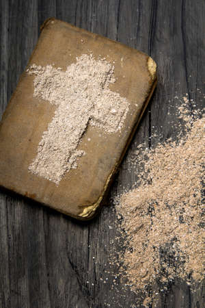 Old Bible and Cross of ash - symbols of Ash Wednesday.の写真素材