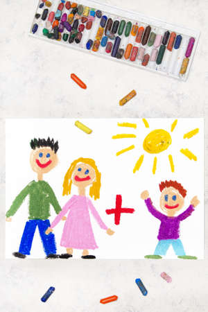 Photo of colorful drawing: Smiling parents plus adopted childの写真素材