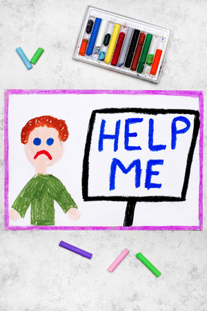 Colorful drawing: Sad boy and sign HELP MEの写真素材