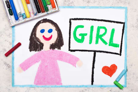 Colorful drawing: Cute smiling girl in pink dress and word GIRL next to herの写真素材