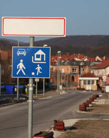 Traffic signs in front of a cityの写真素材