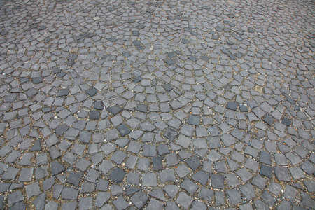 Pavement built by small gray stones. Ideal to use as background.の写真素材